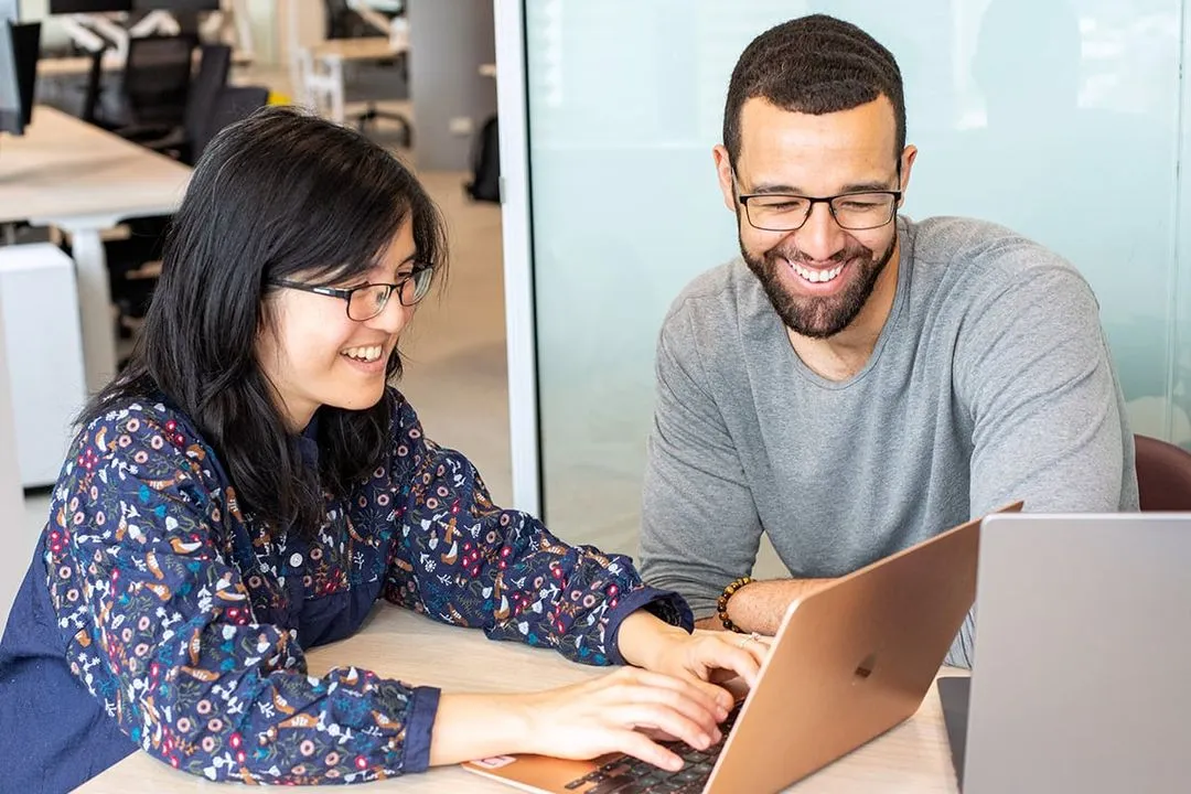Two Lookahead recruiters working together at a laptop